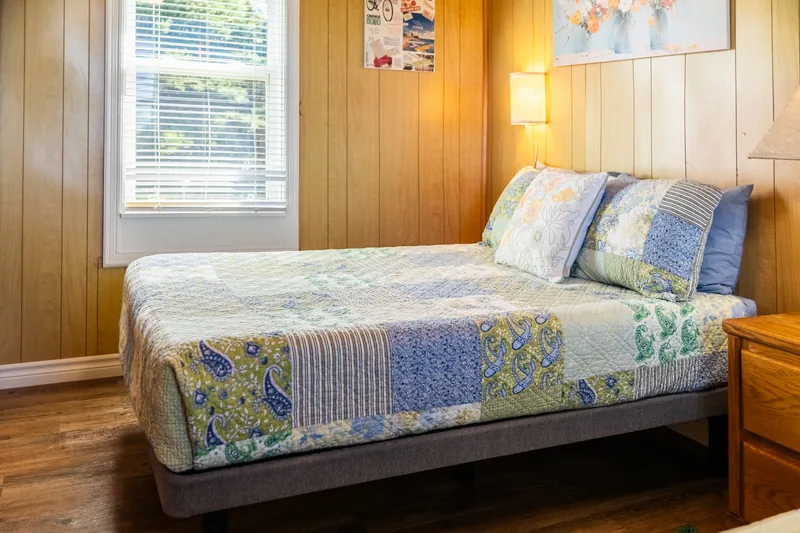 Bedroom with two beds and a window