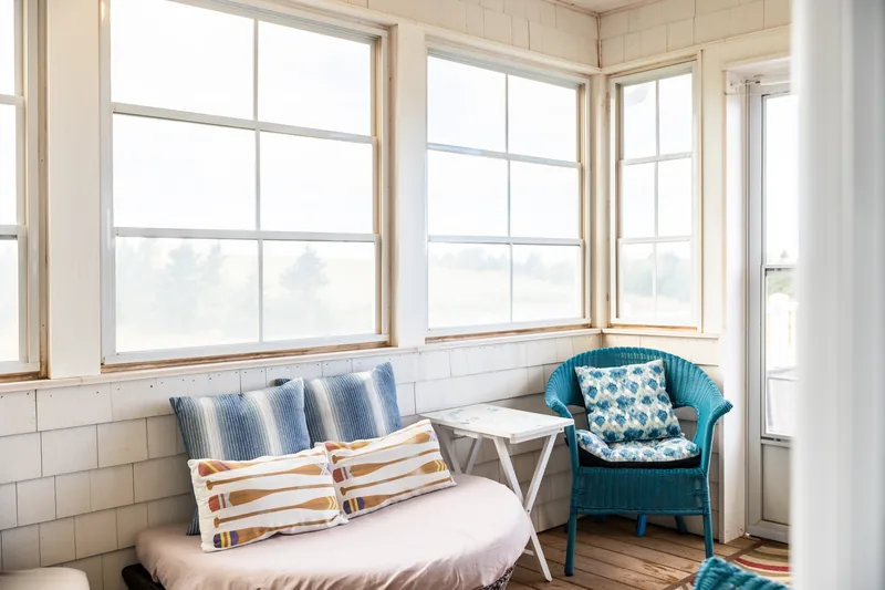 Sunroom with waterfront view