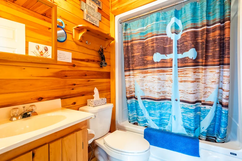 Bathroom with nautical shower curtain