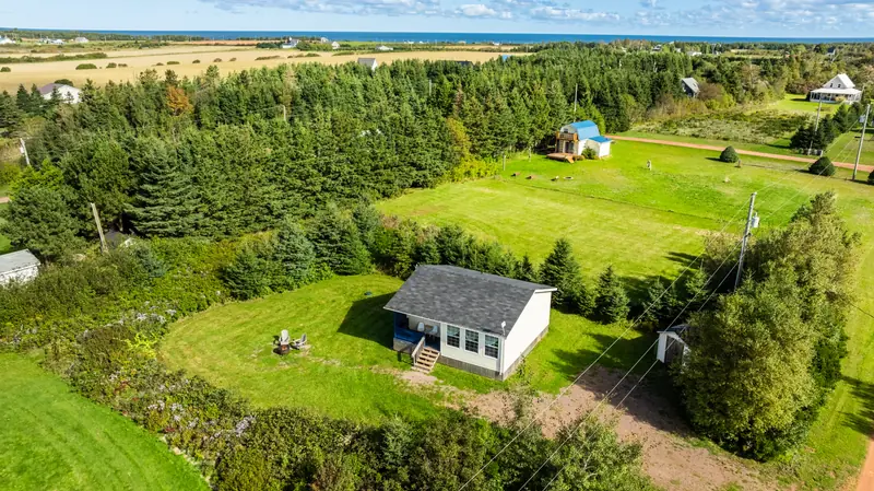Aerial view of the cottage and private lot