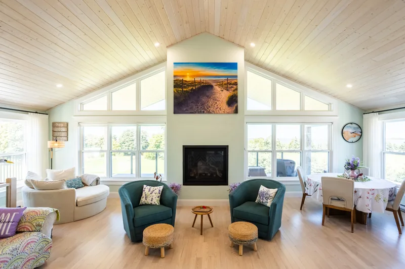 Living room with fireplace and large windows