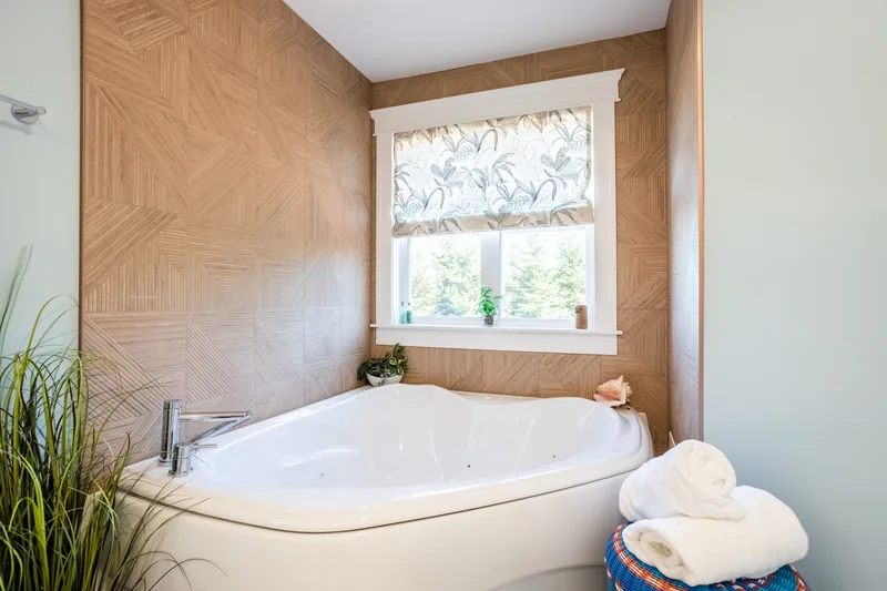 Bathtub beneath the window