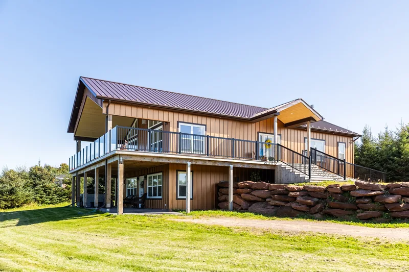 Two-suite house exterior, main level above