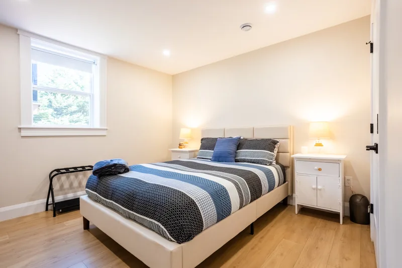 Bedroom with blue bedding and window