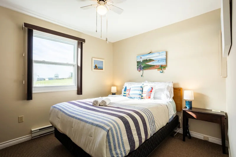 Bedroom with coastal artwork