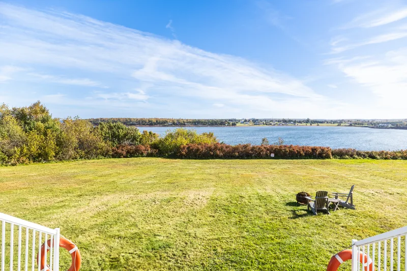 Waterfront lawn and firepit seating